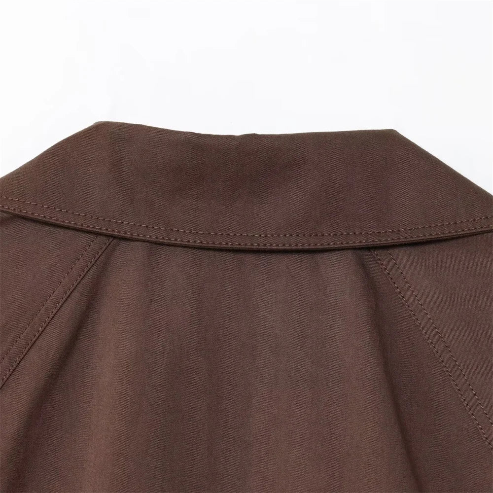 new women's clothing design features a loose and versatile short trench coat with a lapel and waist belt