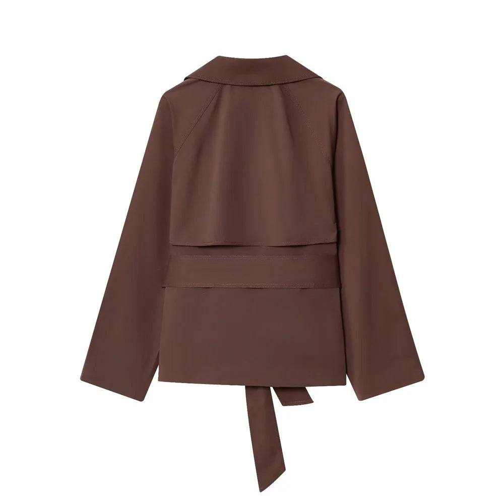 new women's clothing design features a loose and versatile short trench coat with a lapel and waist belt