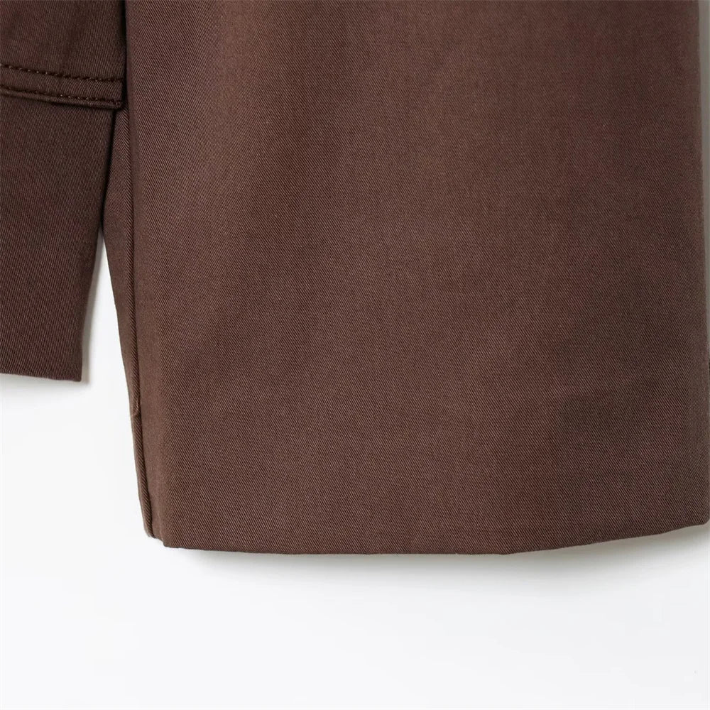 new women's clothing design features a loose and versatile short trench coat with a lapel and waist belt